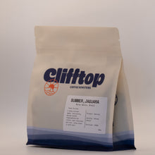 Load image into Gallery viewer, A stand-up coffee bag from Clifftop Coffee Roasters, labeled 'Summer, Jaguara' on a neutral light gray background.
