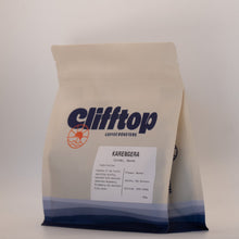 Load image into Gallery viewer, A bag of Clifftop Coffee Roasters Karangera medium roast whole bean coffee, shown on a neutral light gray background.

